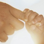 Infant Grasping Mother's Finger