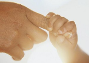 Infant Grasping Mother's Finger